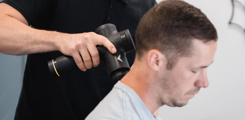 doctor giving an sport massage on a clients neck