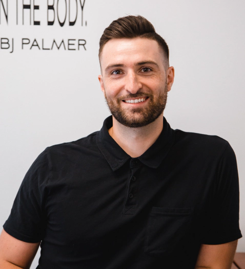 man with a black tshirt and a white background